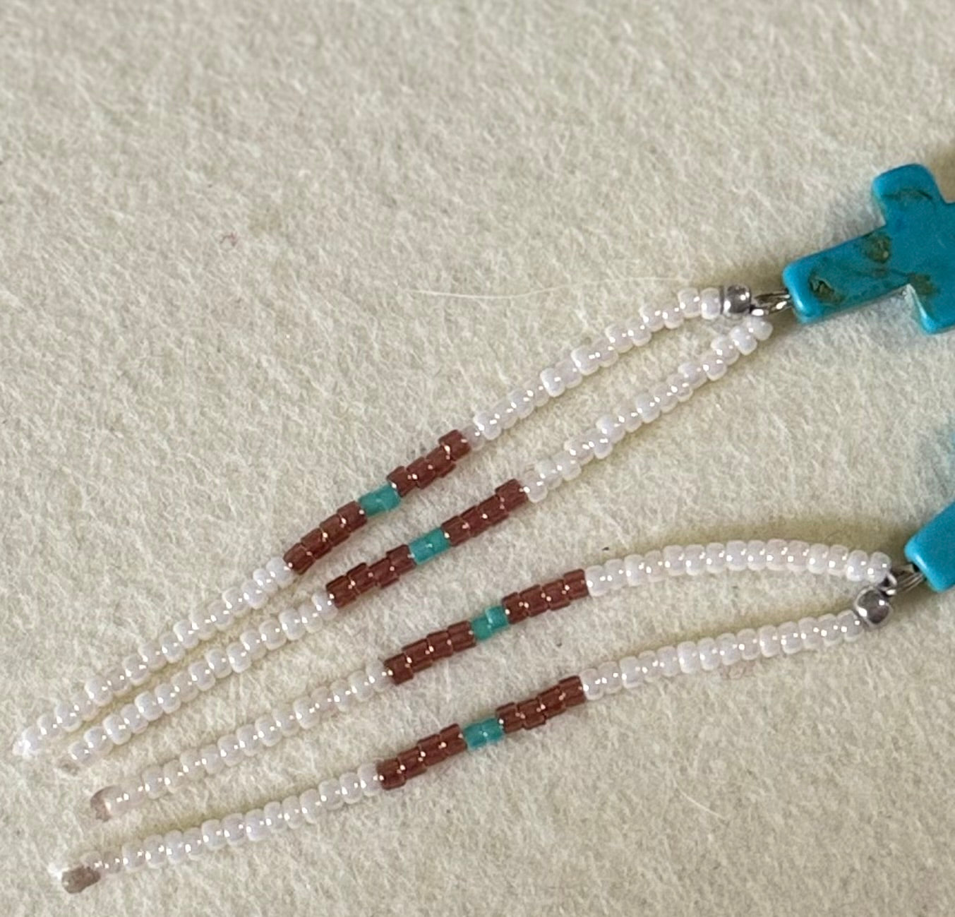 Cross seed bead dangle earrings